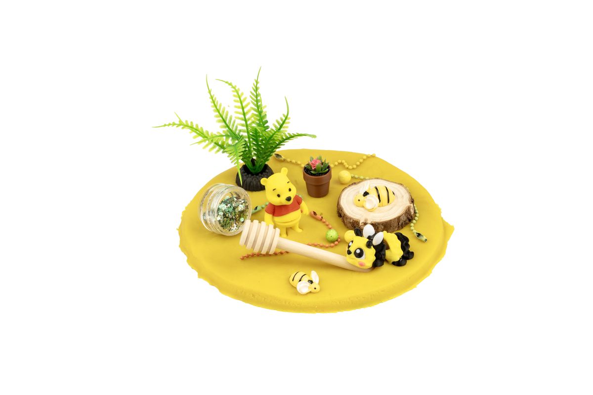 Bee Happy tub opened: yellow doh, a bee, a honey dipper and a plant