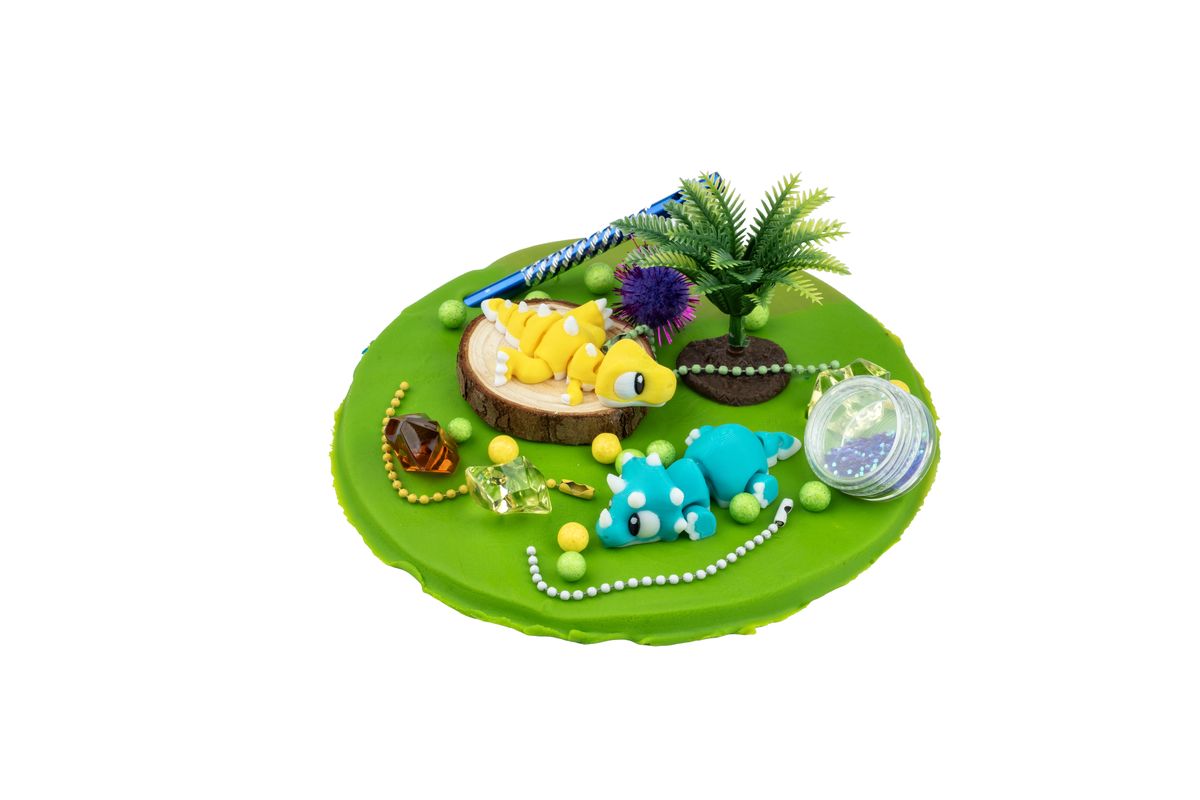 Dino doh scene with dinosaurs and a palm