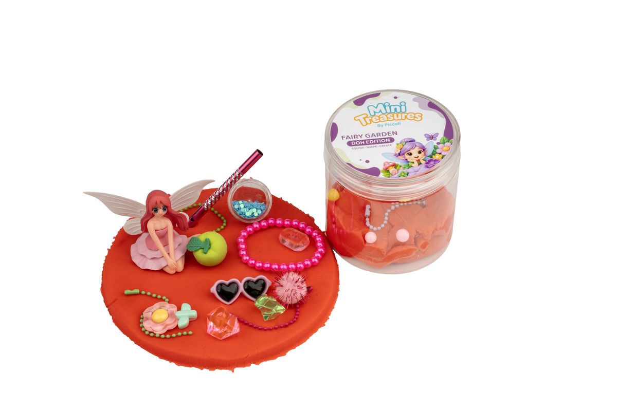 Fairy doh with a fairy figure, beads and flowers laid out