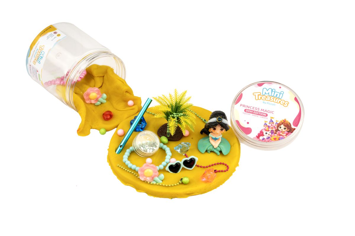 Princess tub opened: yellow doh, a princess figure and jewels
