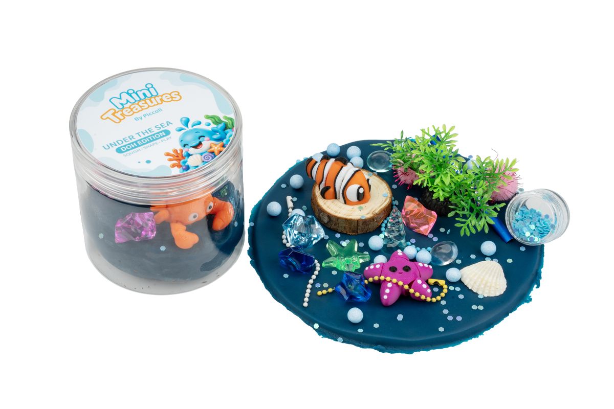Under the Sea tub opened: blue doh, a clownfish, a starfish and sea plants